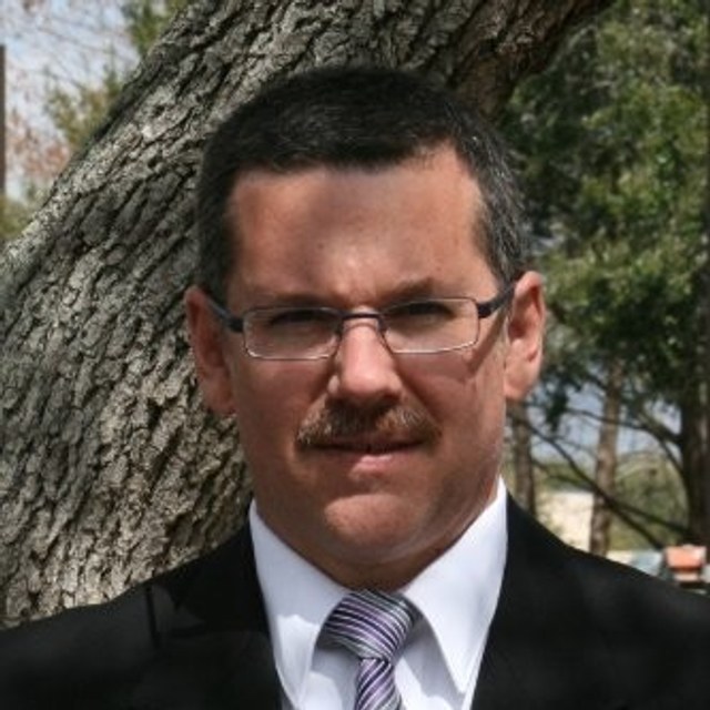Headshot of Mark B. McNeal, PG